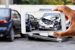 Photo of car accident on road. How to Determine Who is at Fault in a Texas Car Accident. Car Accident Lawyer in Arlington Tx