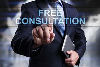 Tesla Autopilot and Full-Self Driving (FSD) Crash Lawyer 4 Businessman is pressing on virtual screen and selecting Free consultation. Tesla autopilot crash lawyer