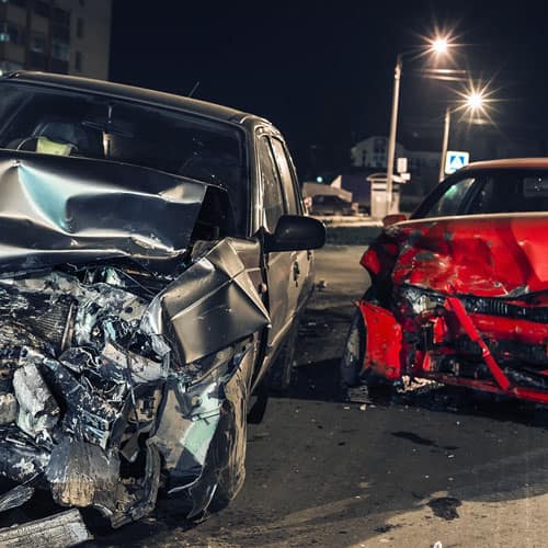 two car crash - red car, grey car.