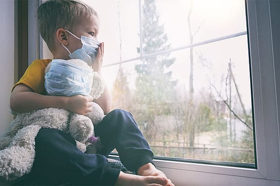 When Will COVID-19 End? 4 Child in a mask because of COVID-19