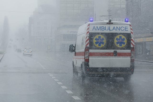 Dallas Police Employee Allegedly Helped "Ambulance Chasers" 2 An ambulance took the patient to the clinic with the turn signals on. Bad weather outside, rain with wet snow. Ambulance chasers committing barratry.