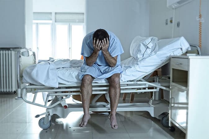 The Multiplier Method: How is Pain and Suffering Calculated? 2 Person in hospital - The multiplier method for calculating pain and suffering damages