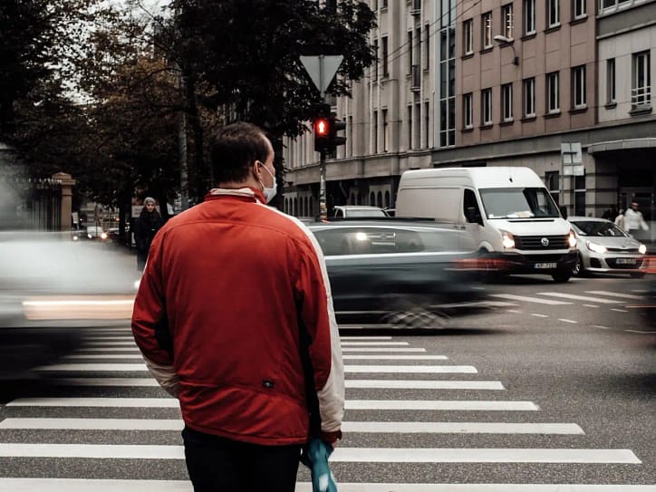 man waiting to cross the road - Long Beach Pedestrian Lawyers